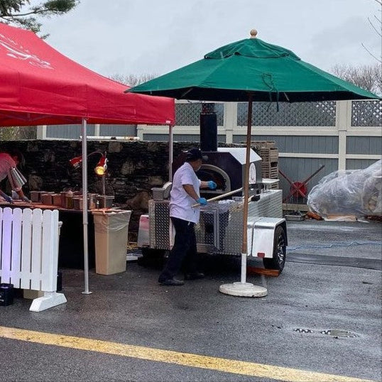 CBO-750 Tailgater Wood Fired Mobile Pizza Oven in Parking Lot