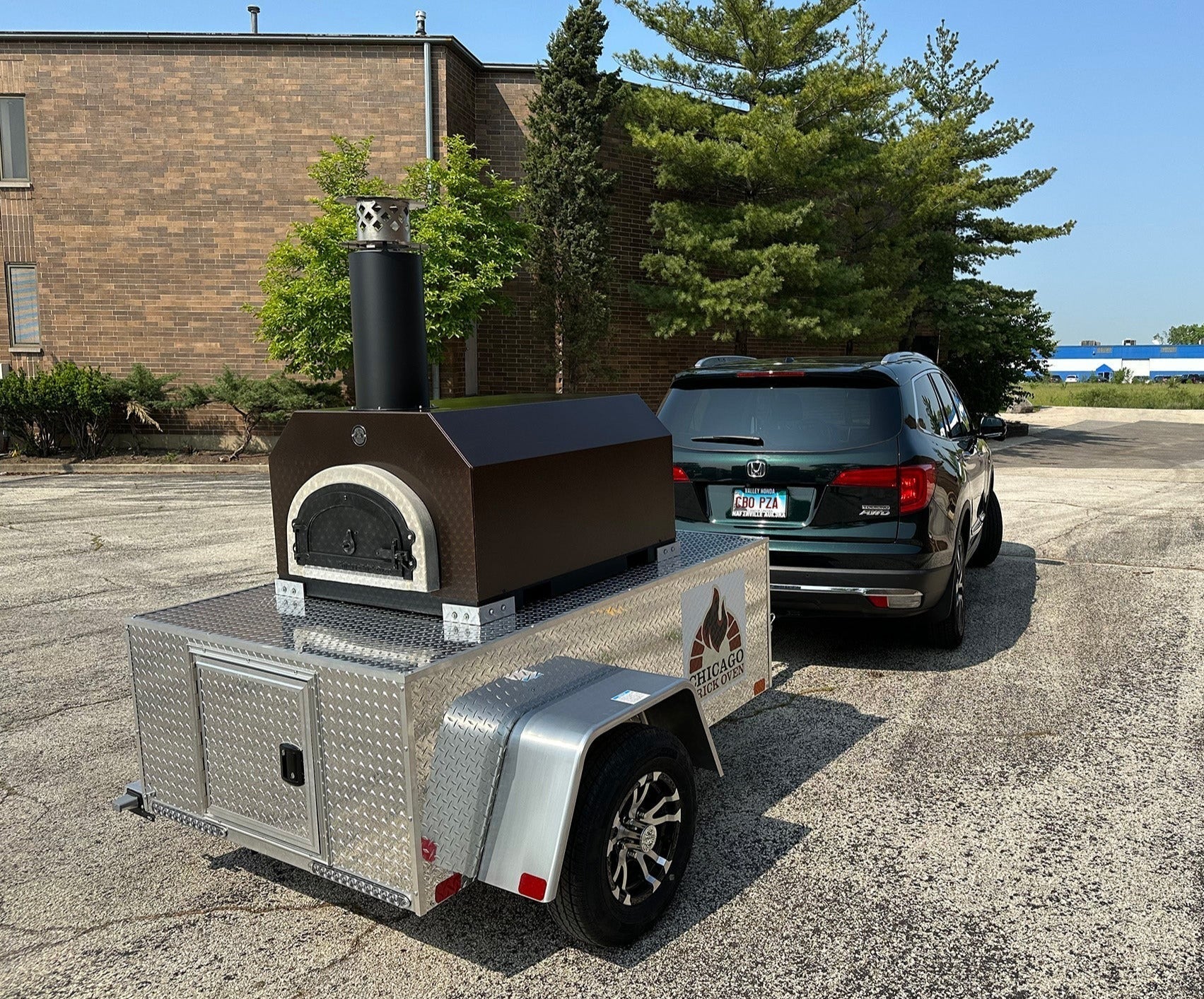 CBO-750 Tailgater Wood Fired Mobile Pizza Oven - CBO-O-TAIL-CV - Copper  - Being Towed 